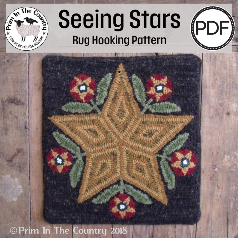Puede incluir: Un patr&oacute;n de tejido de alfombra con una gran estrella dorada rodeada de flores rojas y verdes. El patr&oacute;n se titula "Seeing Stars" y es una descarga PDF.