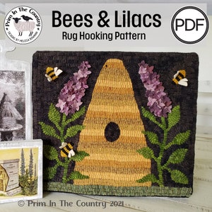 May include: A rug hooking pattern featuring a beehive with a hole in the front, surrounded by two sprigs of purple lilacs and bees. The pattern is titled "Bees & Lilacs" and is a PDF download. The text "Prim In The Country" is at the bottom of the image.