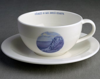 He Lost the Tide - Ceramic tea cup & saucer with decal print titled ‘chaill e an seòl-mara’
