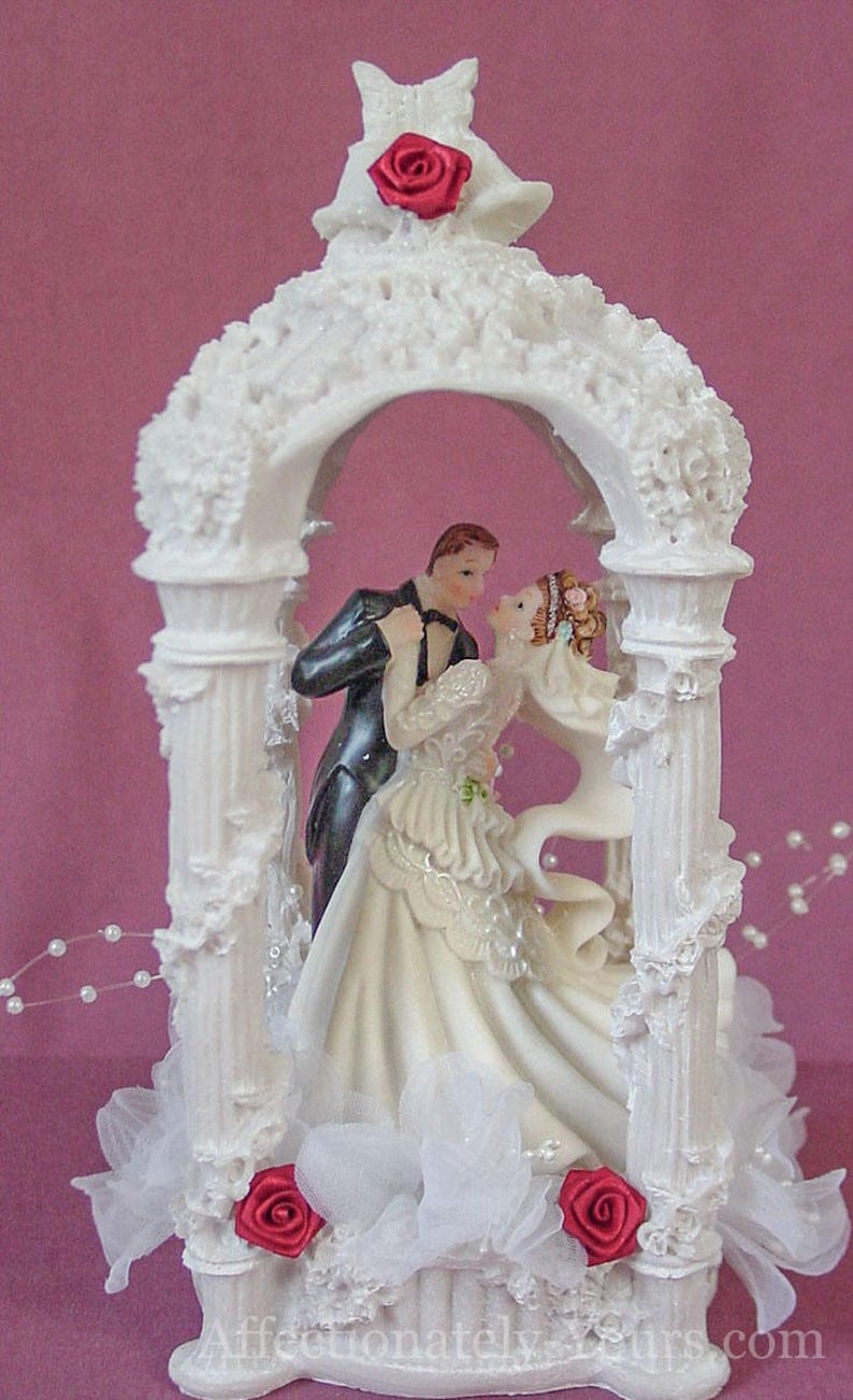 Elegant gazebo customized wedding cake topper graced with bride and groom with your hair color. Ethnic skin and clothing alteration available. Several poses to choose from.