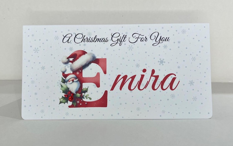 May include: A set of three ceramic mugs with a speckled, matte finish. The mugs are in shades of cream, light gray, and dark gray. Each mug has a simple, minimalist design, perfect for coffee or tea.