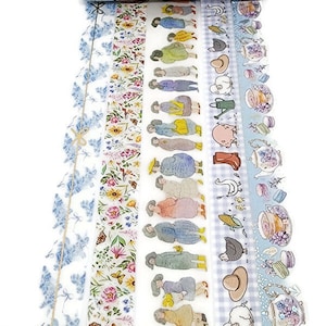 May include: A set of 8 washi tapes featuring various designs, including floral patterns, illustrations of people, and farm animals. The tapes are all on a white background with blue accents.