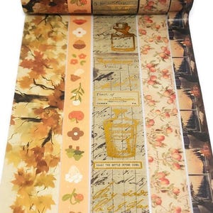 May include: Decorative washi tape rolls featuring various designs. The tape includes patterns of autumn leaves, floral motifs, and vintage apothecary labels with text. The color palette includes shades of brown, orange, and cream.