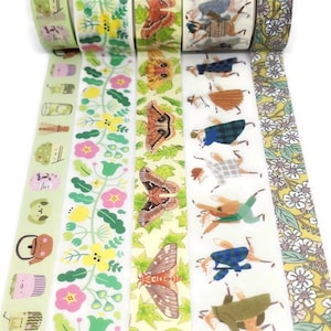 May include: Set of six washi tapes with different designs. One tape features a floral pattern with pink and yellow flowers, another has a pattern of moths on a yellow background, another has a pattern of foxes in different outfits, another has a pattern of teapots and teacups, another has a pattern of flowers and leaves, and another has a pattern of small white flowers on a yellow background.