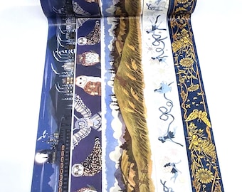 May include: Five rolls of decorative washi tape featuring distinct patterns: a night train scene, a series of owls on a dark blue background, a rolling green landscape, small blue fairy figures on a white background, and gold floral motifs.