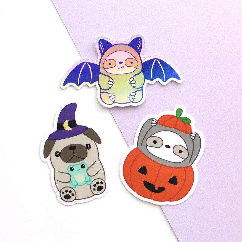 Vinyl sticker Halloween trio: wizard pug, sloth in Jack-o'-lantern and bat sloth cryptid