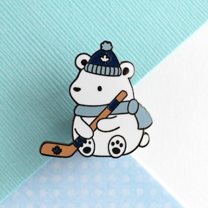 Polar Bear Playing Hockey Enamel Pin. Cute Hockey Gift. Adorable Sports Pin. Bear w Maple Leaf Hat. Hockey Animal Badge. Canada Sports Gift