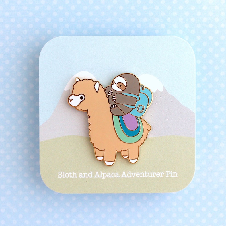 Backing card for an enamel pin of a sloth wearing a backpack and riding on top of an alpaca (or llama)