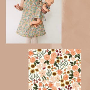 May include: A dress with a multi-colored floral pattern featuring pink, orange, and green flowers on a white background. The dress has short flutter sleeves and a gathered neckline. A matching doll dress is included in the same floral print.