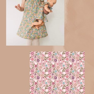 May include: A floral print dress with flutter sleeves and a matching doll dress in the same pattern. The fabric features a pink background with small flowers in shades of pink, purple, and teal. The text HAPPY PETALS ROSE is printed below.