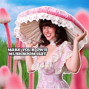 May include: A pink mushroom hat with a white lace trim is held up by a person. The hat has a pink velvet top and a cream-colored underside. The text "MAKE YOUR OWN MUSHROOM HAT" is displayed in the image.