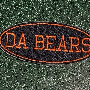 May include: A white ceramic mug with a black handle and the text "But First, Coffee" in a black, bold font. The mug is sitting on a wooden surface. The mug is approximately 4 inches tall.