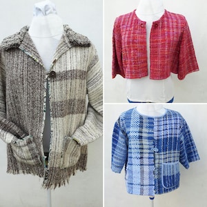 May include: Three different woven jackets displayed on mannequins. The jackets include a brown and cream striped jacket with a large collar and pockets, a red cropped jacket, and a blue plaid jacket with three buttons and pockets.