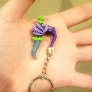 Slay The Spire, Book of Stabbing Keychain, Shows no mercy only attack