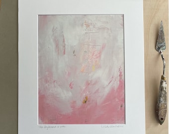 May include: A white matted print of an abstract painting with pink and white paint. The painting is titled "She daydreamed in pink" and signed "Lisa Jensen".
