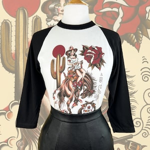 Rodeo Queen Unisex Raglan Graphic T-shirt in Natural/Black Vintage inspired by Mischief Made, traditional american tattoo