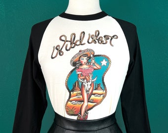Wild West 3/4-Sleeve Unisex Raglan T‑Shirt in White/Black Vintage inspired by Mischief Made, Cowgirl