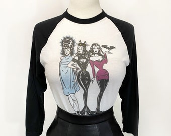 The Ladies Who Lunch  3/4-Sleeve Unisex Raglan Graphic T-shirt in white/Black Vintage Halloween inspired by Mischief Made monster pinup