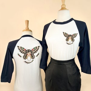 Butterfly Lady Unisex Raglan Graphic T-shirt in Natural x Navy Vintage inspired by Mischief Made