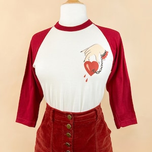Captive Heart Unisex Raglan Graphic T-shirt in Natural x Red/ Vintage inspired by Mischief Made Tattoo design