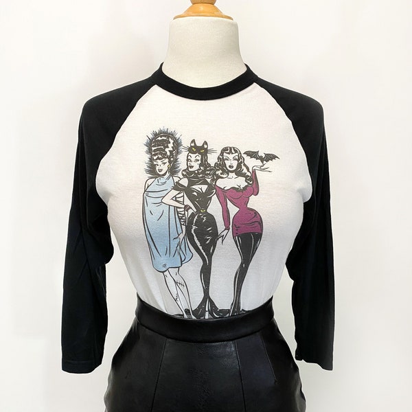 The Ladies Who Lunch  3/4-Sleeve Unisex Raglan Graphic T-shirt in white/Black Vintage Halloween inspired by Mischief Made monster pinup