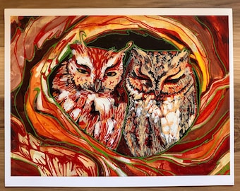 May include: A watercolor painting of two owls nestled together. One owl has red and white feathers, the other has brown and white feathers. They are surrounded by a vibrant, abstract nest of red, orange, and green.