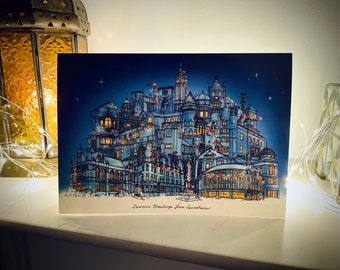 Może przedstawiać: Kartka świąteczna z ilustracją nocnego panoramy miasta. Budynki są ozdobione światełkami i girlandami. Na kartce widnieje napis "Seasons Greetings from Lewiston".