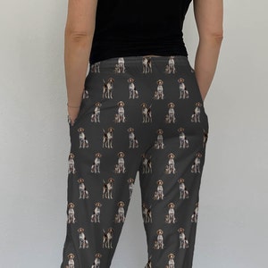 May include: Gray sweatpants with a repeating pattern of brown and white German Shorthaired Pointers.