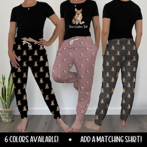 May include: Three pairs of pajama pants in black, mauve, and gray, each covered in a repeating pattern of a corgi dog. A black t-shirt with a corgi graphic and custom text is shown. The text "6 COLORS AVAILABLE!" and "ADD A MATCHING SHIRT!" are at the bottom.