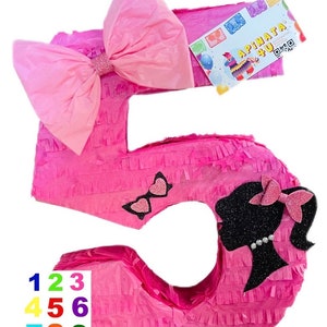May include: Pink number 5 shaped pinata with a pink bow, black silhouette of a girl with a pink bow, and sunglasses with glitter hearts. The pinata has the text "APINATA 4 U" on a tag.