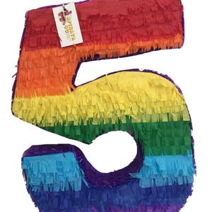 May include: A colorful number 5 piñata, perfect for a birthday celebration. The piñata is made of crepe paper in a rainbow of colors, including red, orange, yellow, green, blue, and purple. A tag with the text "APIÑATA" is attached.