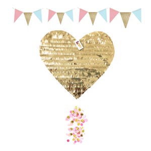 May include: A gold heart-shaped piñata with a tag, surrounded by a garland of pink, gold, and light blue triangle flags. A pile of pink, gold, and white confetti is at the bottom. Party decorations.