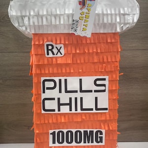 May include: Orange and white pinata shaped like a pill bottle with the text "Rx Pills Chill 1000mg" on the front.