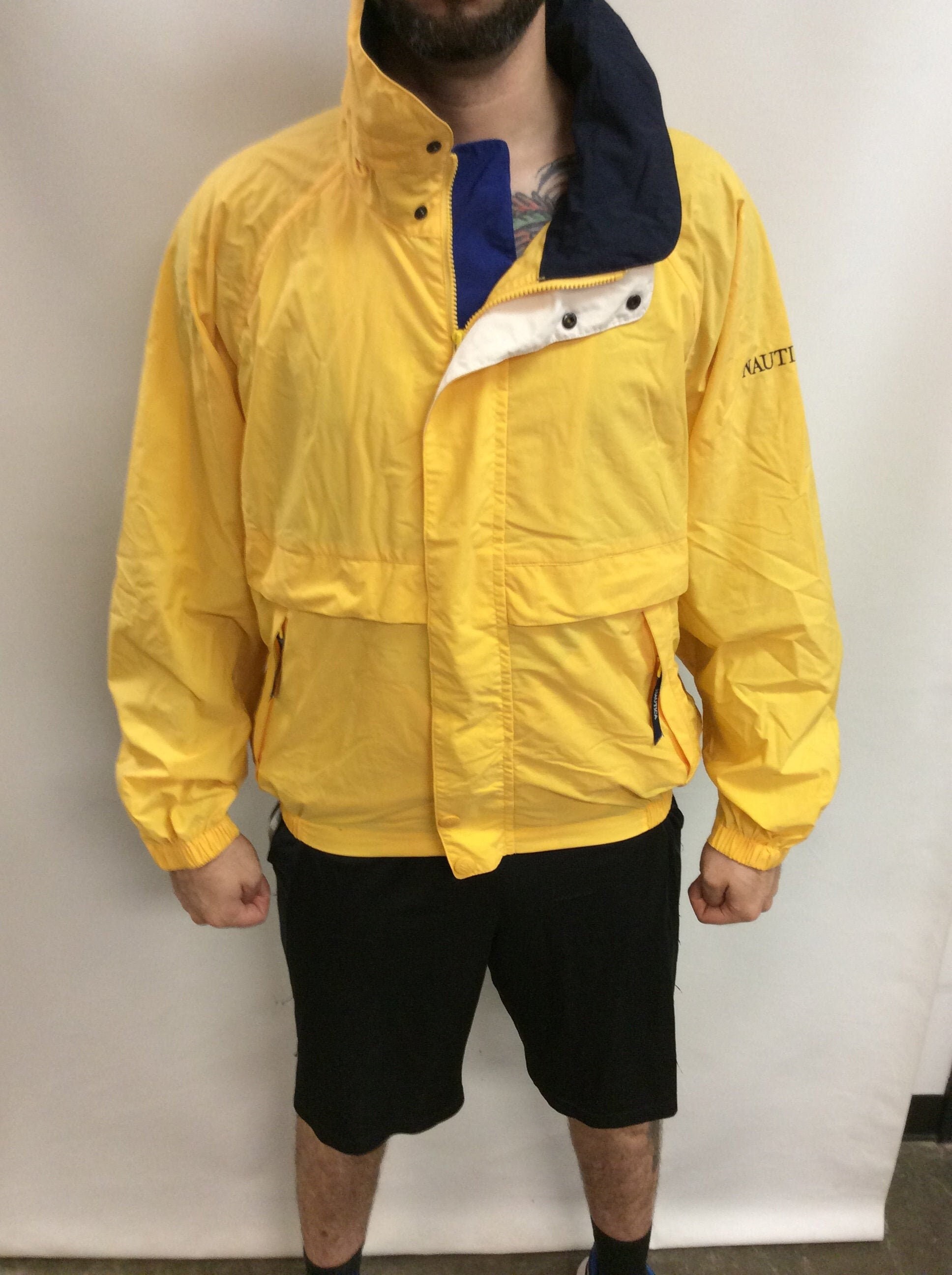 yellow and navy blue windbreaker