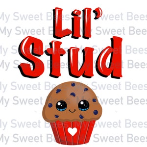May include: A cartoon graphic with the words "Lil' Stud" in red, outlined in black, above a muffin. The muffin is brown with blueberries, a smiling face, and a red liner with a white heart.