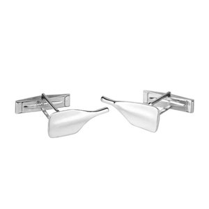 May include: A pair of silver cufflinks, each shaped like a wine bottle. The cufflinks have a polished, reflective surface and a classic bar backing. The design is simple and elegant, suitable for formal wear.