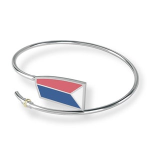 May include: Silver bangle bracelet with a red, white, and blue enamel charm. The charm is shaped like a triangle and has a gold accent.