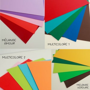 May include: Assortment of colored cardstock paper in various shades of red, pink, purple, blue, green, yellow, and brown. The paper is arranged in stacks and labeled with the names "Melange Amour", "Multicolore 1", "Multicolore 2", and "Melange Verdure".