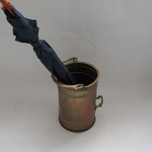 umbrella stand antique, antique bucket, umbrella stand vintage, very old umbrella stand, iron umbrella stand, old metal bucket, hammered