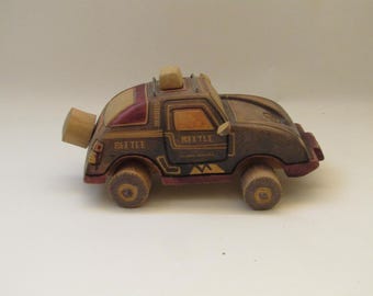 Vintage Handcrafted Wooden Beetle Car Sculpture: Retro Toy Vehicle