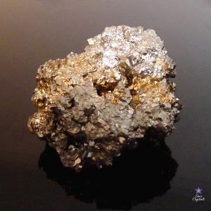 May include: A large, rough, gold and silver pyrite crystal cluster. The crystal has a metallic sheen and is composed of many smaller crystals.