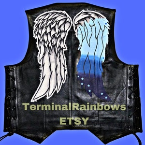 May include: Black leather vest with white and blue angel wings painted on the back. The vest has a lace-up closure on the sides. The text "TerminalRainbows ETSY" is printed on the bottom of the vest.
