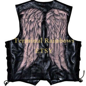 May include: Black leather vest with a lace-up front and a faded angel wing design on the back. The text "Terminal Rainbows ETSY" is printed on the back.