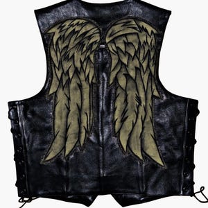 May include: Black leather vest with a large, detailed angel wing design on the back. The wings are a faded gold color with black outlines, creating a striking contrast against the black leather. The vest has a lace-up detail on the sides.