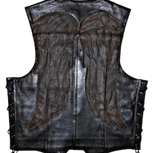 May include: Black leather vest with a distressed, textured appearance. The back features large, dark-colored angel wings. The vest has a lace-up closure on the sides and a classic biker style.