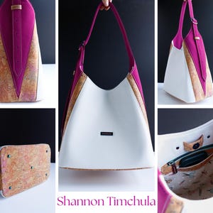 May include: A white, pink, and cork shoulder bag with a unique design. The bag features a white body, pink accents, and cork detailing. The bag has a long strap and a small label. The bag is shown from multiple angles.