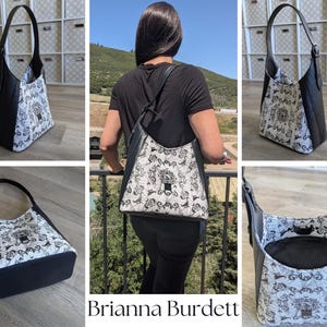 May include: A black and white shoulder bag with a unique pattern. The bag features a black base and handle, with a white patterned front. The bag is shown from multiple angles, including a person wearing it. The text "Brianna Burdett" is visible.
