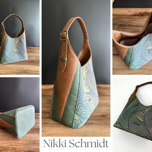 May include: A handcrafted shoulder bag with a unique design. The bag features a combination of blue patterned fabric, brown leather accents, and a green panel. The bag has a single handle and a spacious interior. The bag is a stylish accessory.
