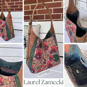 May include: A floral print shoulder bag with brown leather accents and a green panel. The bag features a long strap and a buckle closure. The interior is lined with a patterned fabric. The bag has the text "Eastfarthing Bags" and "Laurel Zamecki".