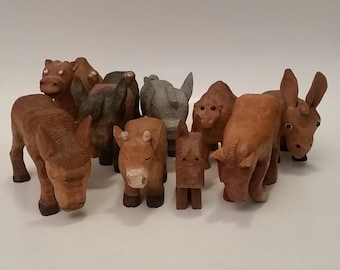 Carved wood animal | Etsy